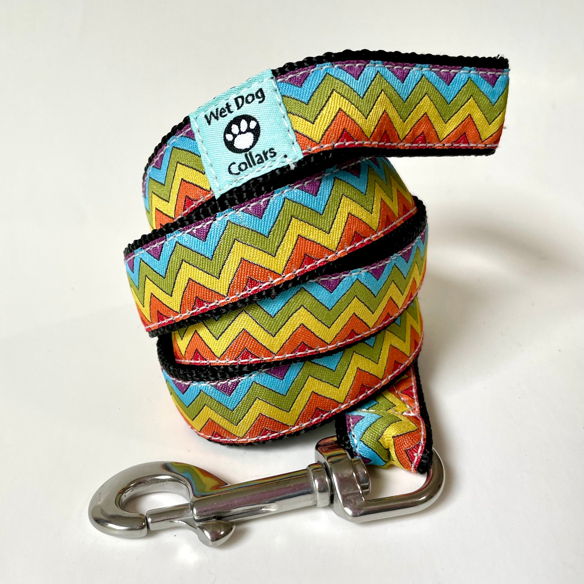 Colorful zigzag patterned dog leash with saltwater proof stainless clip, marine materials and durable construction.