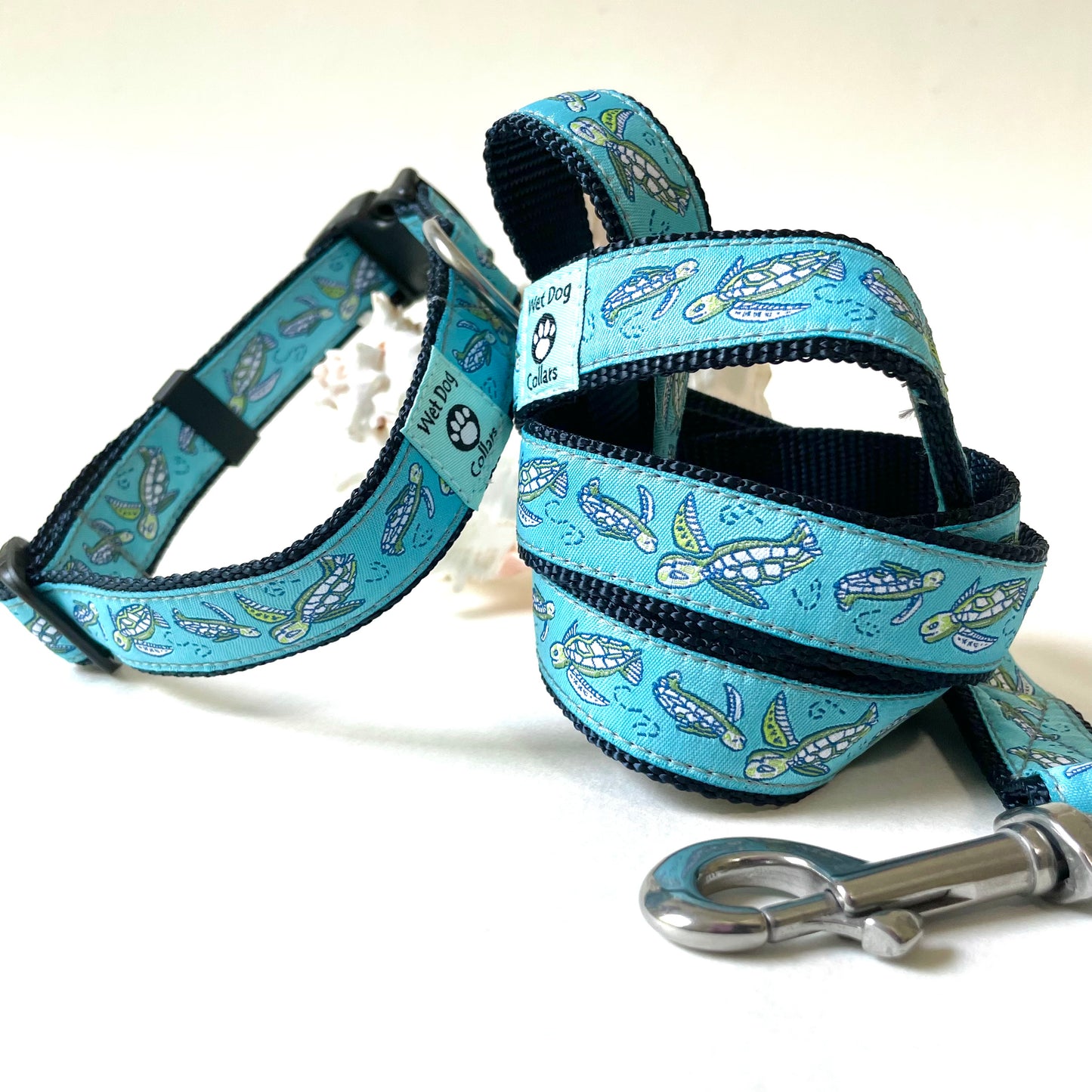 Dog collar and leash set with sea turtle pattern on an aqua background made for the coastal dog with rust proof stainless hardware and durable construction