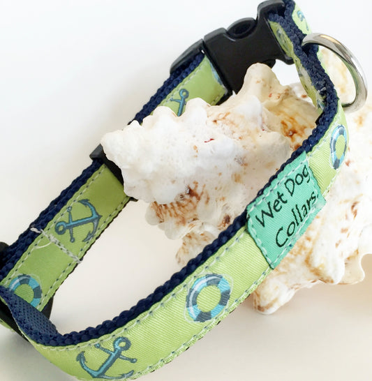 Green and blue dog collar with anchor pattern and saltwater materials for beach use